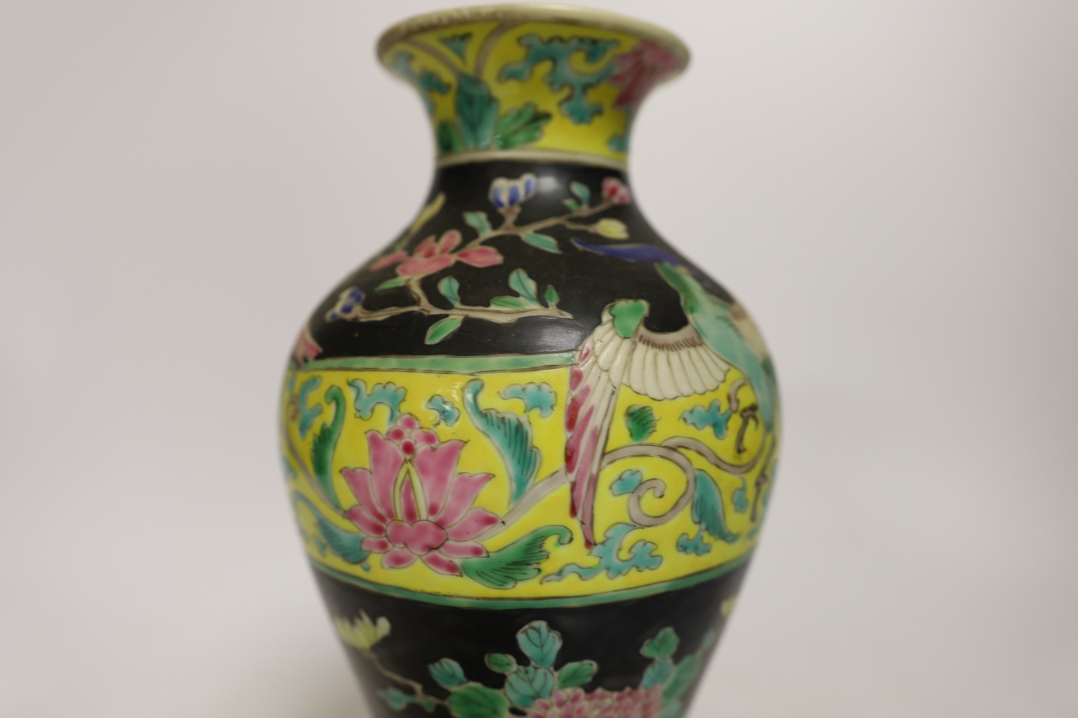 Chinese porcelain- a tall 19th century famille rose vase and cover, a famille rose jar, early 19th century probably made the Indian market, a famille noire jar and a Japanese vase, tallest 28cm high